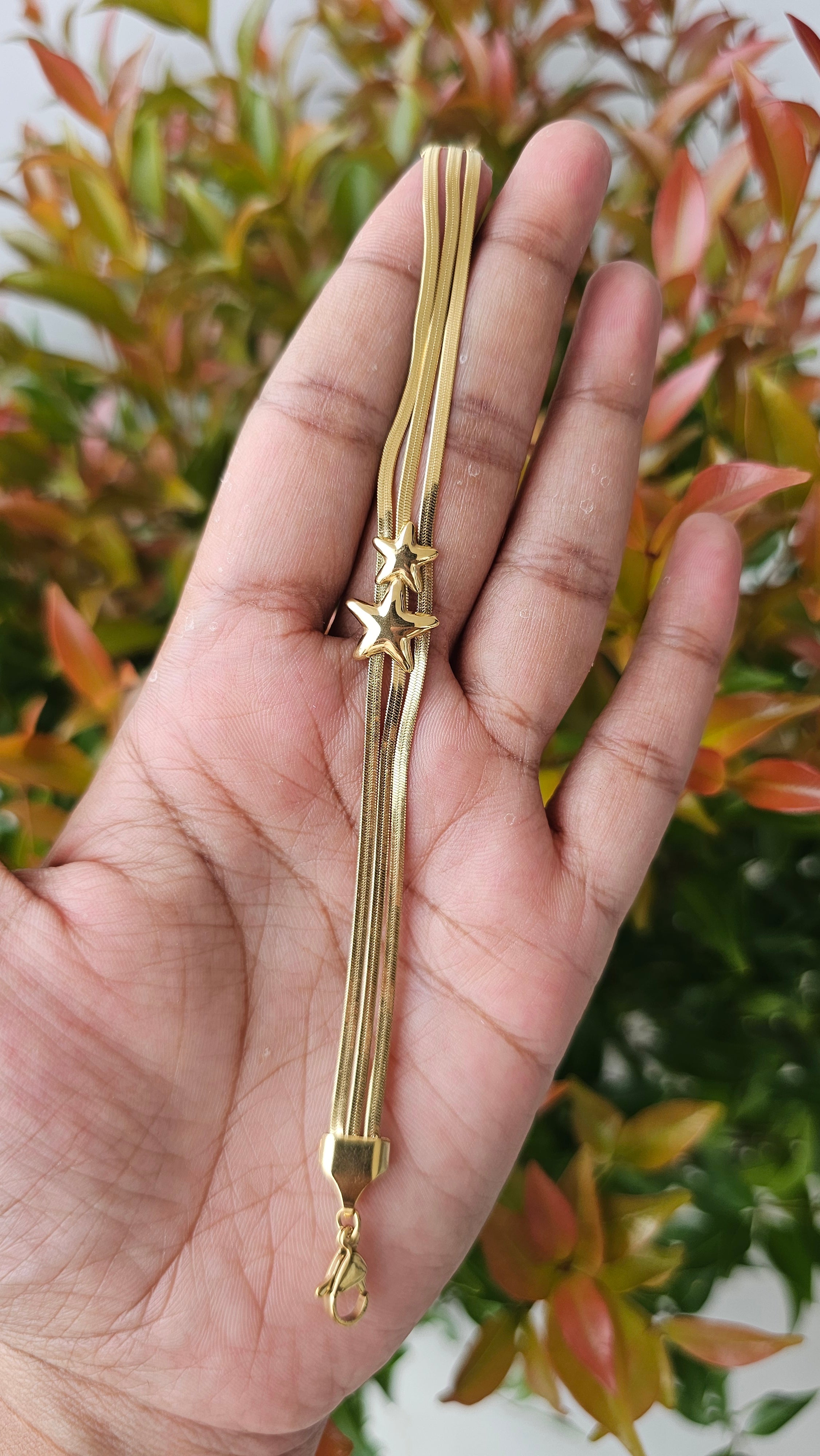 Multi layer gold tassel chain bracelet
