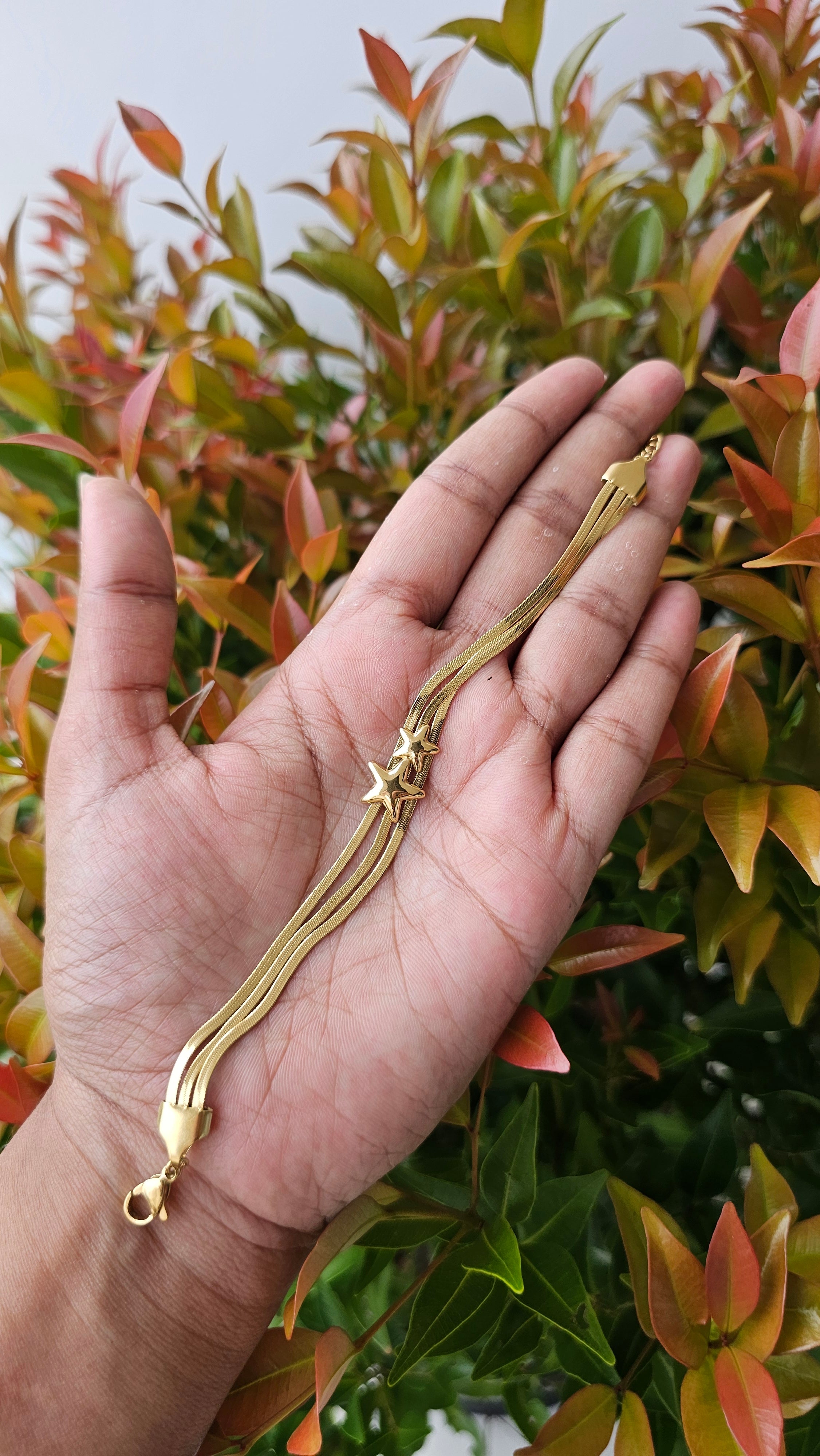 Multi layer gold tassel chain bracelet