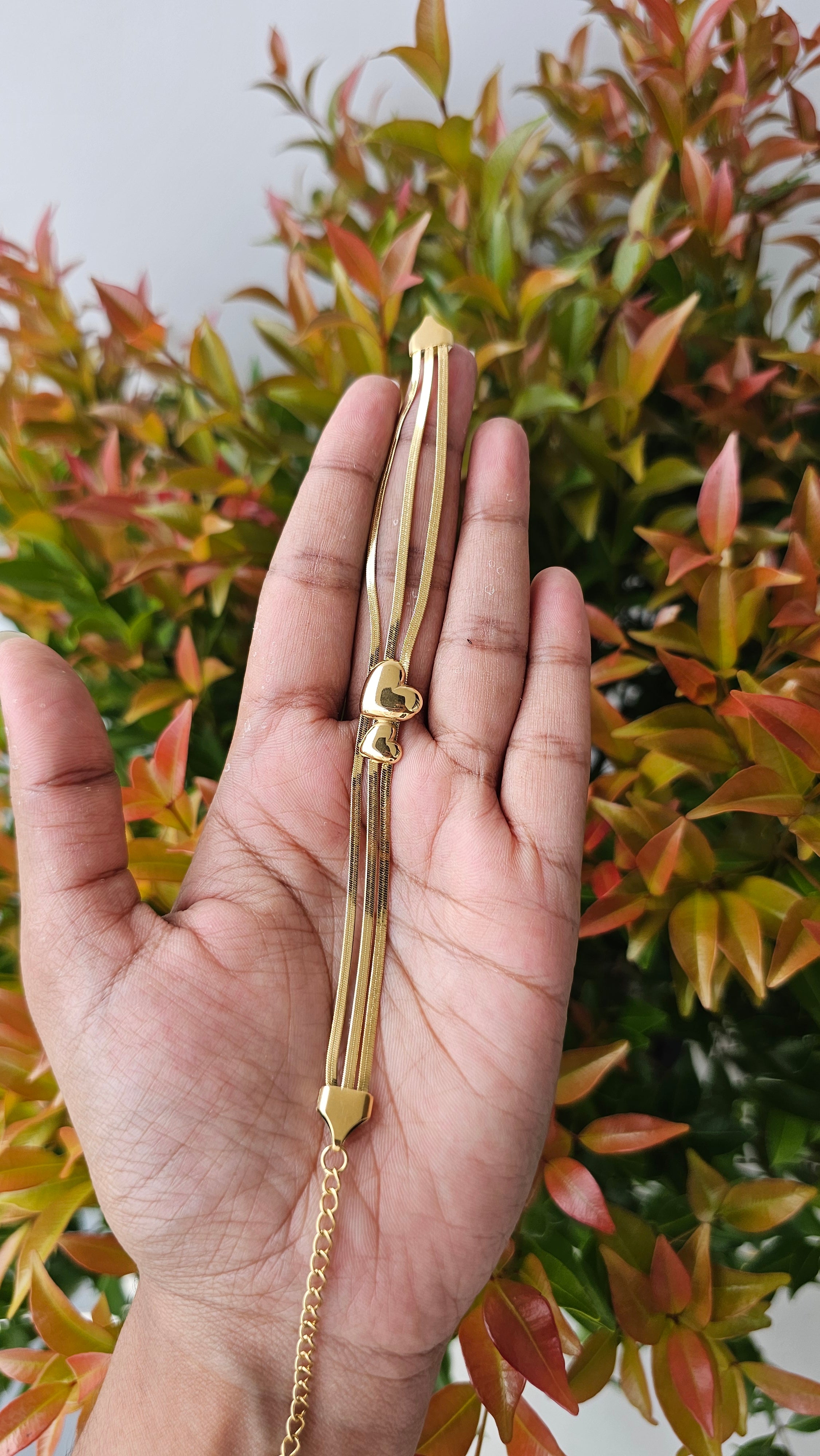 Gold lariat love bracelet
