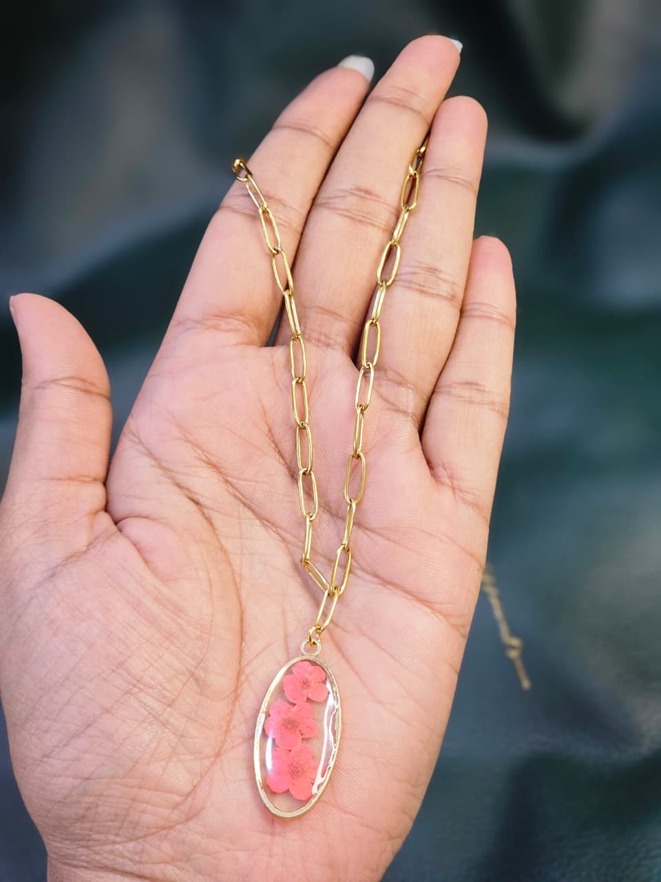 Pink flower oval resin necklace