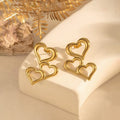 Triple heart gold drop earrings