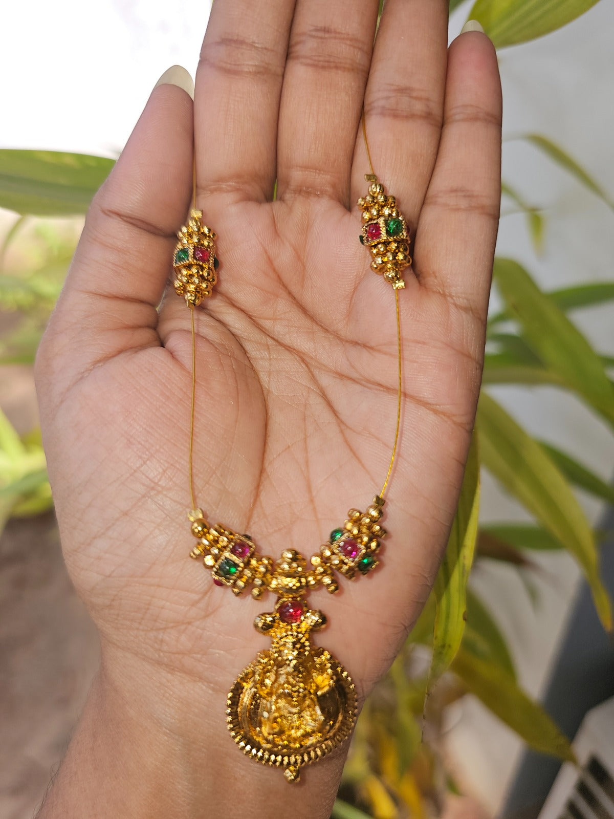Traditional lakshmi necklace set with ruby-emerald stones