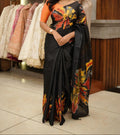 Black with orange flower design saree