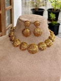 GOLD GLOBE STATEMENT NECKLACE